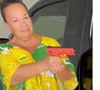 Woman Holding Byrna Pepper Gun